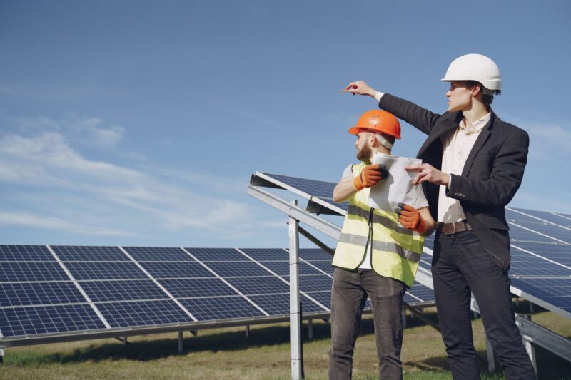 Ground-mount solar array installation with driven pile foundations and racking